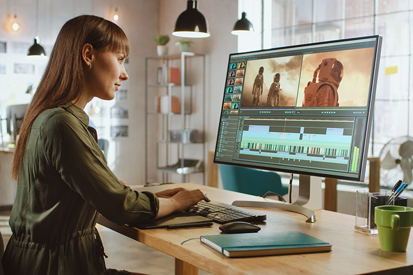 woman video editing at home